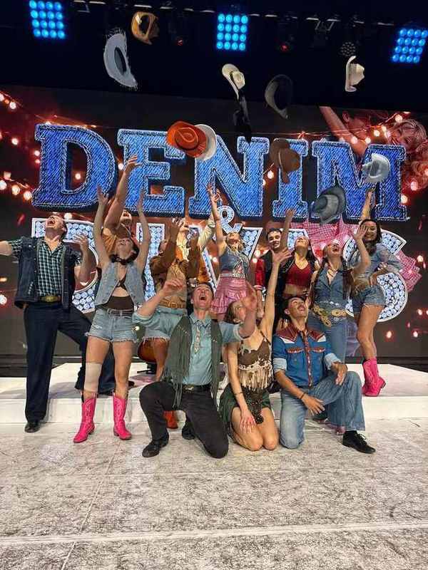 The Denim and Divas cast tossing their hats in the air